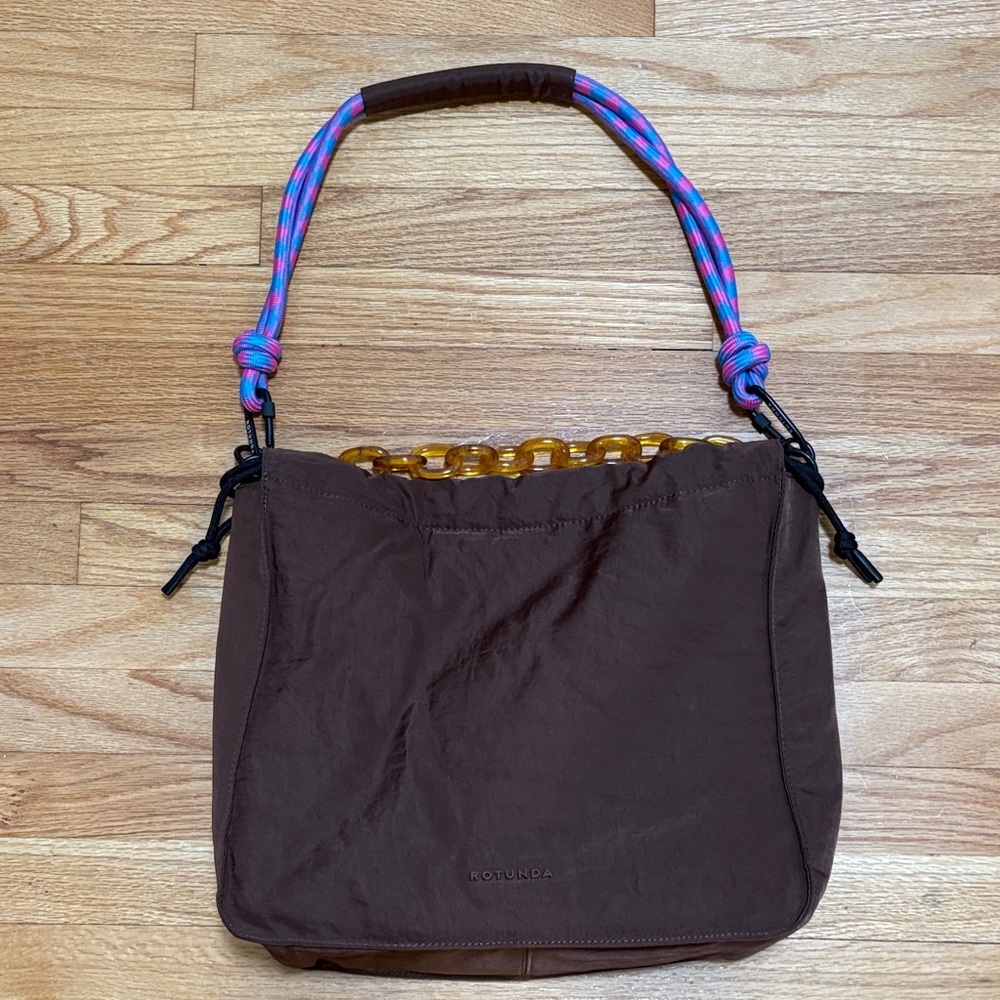 Rotunda Chic Brown Bag with Vibrant Handle